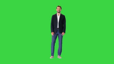 Handsome young business man happy smile on a Green Screen, Chroma Key.
