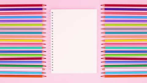 6k Colorful colored wooden pencils on pink theme. Drawing stationery stop motion