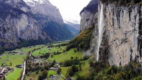 Aerial view over the village of Lauterbrunnen in Switzerlandwith its famous waterfall - drone footage