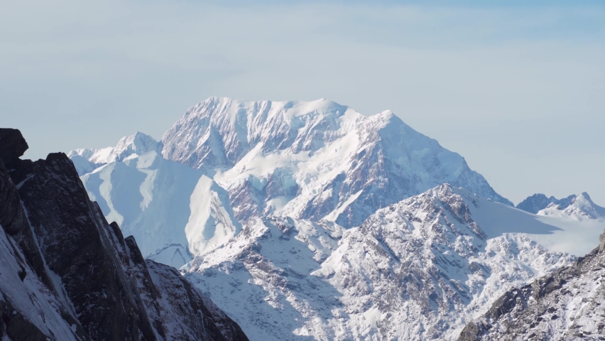 Distant view of the majestic Mount Cook (3724 meters high) called Mount Aoraki in Maori and highest mountain of New Zealand from Mount Herman, Canterbury, Southern Alps