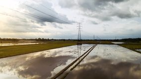 Aerial View of Pylon at middle of paddy field. - Powered by Shutterstock - Get 15% off with code: PIKWIZARD15
