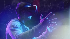 Teenager having fun play VR virtual reality glasses Metaverse sport game 3D cyber space futuristic neon colorful background, future digital technology game and entertainment - Powered by Shutterstock - Get 15% off with code: PIKWIZARD15