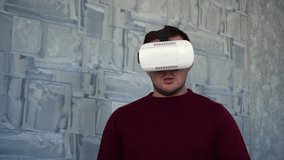 man uses vr glasses while at home.