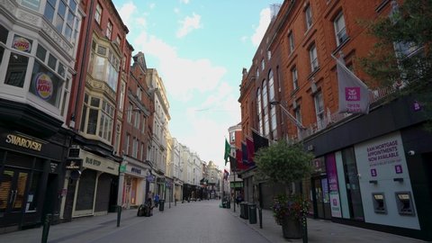 Dublin Ireland - January 28th 2021: Walking in Famous Grafton Street in Dublin during coronavirus pandemic. Usually busy street with irish music turned into almost empty space.