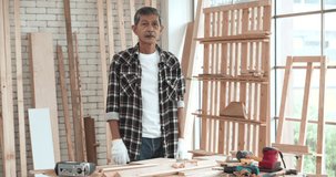 Professional carpenter vlogger giving online workshop making DIY wooden class. Asian senior blogger influencer talking to camera recording tutorial video wood work course in carpentry. POV Webcam view