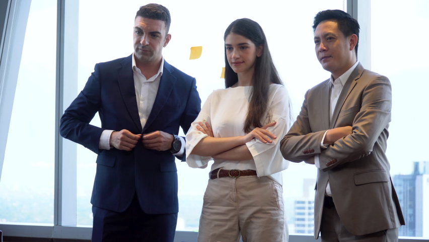 Group of tree  diversity business People standing with arms crossed on window in office at high cityscape 
