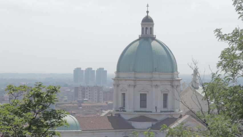 Point of view from the castle of Cathedral of Santa Maria Assunta with green copper dome.
Brescia, Lombardy, Northern Italy.
Blur and focus, panning from top to bottom, focus and blur.