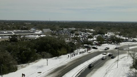 Austin, Texas   USA - February 16 2021: Drone Timelapse of Long Lines at HEB Grocery Store Following Power Outages and Frigid Temperatures