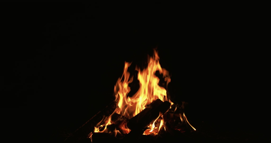 Campfire on black. Fire flame animation. Glowing charcoal. Yellow burning wood logs for night barbecue isolated on dark warm atmosphere background. Royalty-Free Stock Footage #1067941508