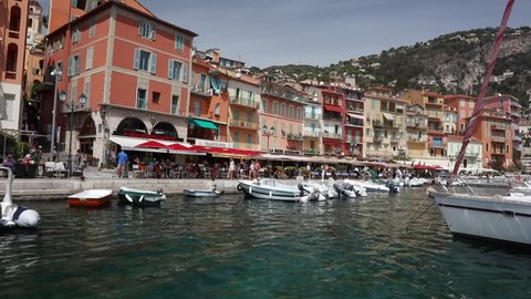 VILLEFRANCHE SUR MER, FRANCE, EUROPE – 9 AUGUST 2016: Video clip of shops and restaurants on the seafront, Villefranche Sur Mer, Alpes Maritimes department in the Cote d'Azur of the French Riviera
