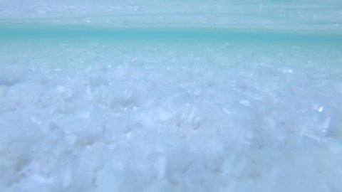 Underwater view of the salt crystals of Uyuni salt flat in Bolivia