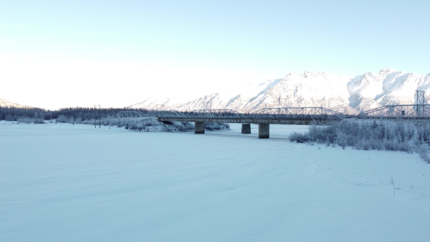 4k Aerial video of the Knik River bridge. Palmer, Alaska. Winter 2021