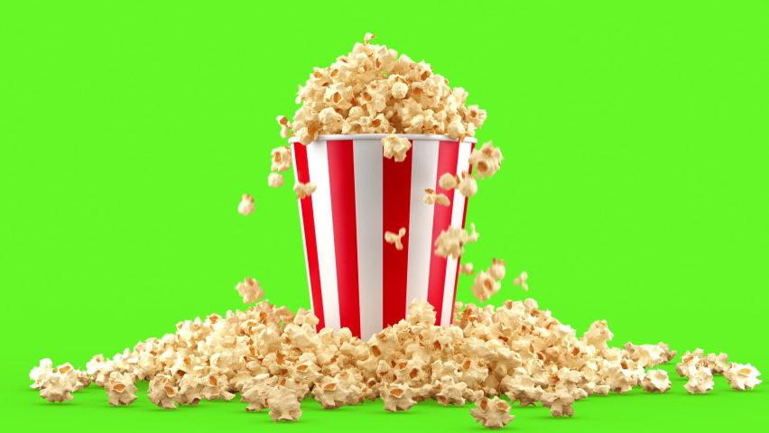 Popcorn falling out of a red-white striped bucket on a green background, nice background (4K,ultra high definition 2160p)