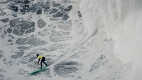 Nazaré, Portugal, 3 March 2020: A surfer falls on his back from the longboard