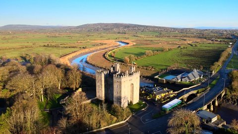 Bunratty Castle and Durty Nelly's Pub, Ireland - Jan 3rd 2021: Aerial view over a beautiful location in County Clare, on the banks of the River Ralty. Bunratty village in County Clare, Ireland.