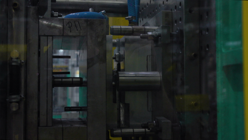 Large industrial machine drills hole screwing together piece in factory work chain automated innovation futuristic prototypes assembly line for production of items business manufacturing parts sale 