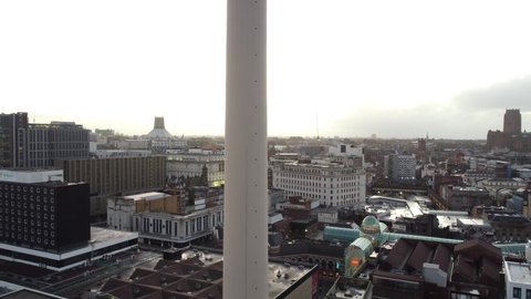 Liverpool , Merseyside , United Kingdom (UK) - 01 18 2021: Aerial rising view reveal Liverpool landmark radio city tower empty city skyline during coronavirus pandemic