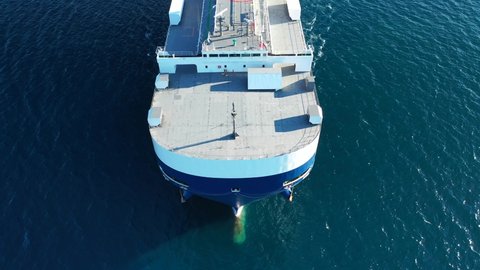 Aerial drone video of huge car carrier ship RO-RO (Roll on Roll off) cruising in Mediterranean deep blue ocean sea