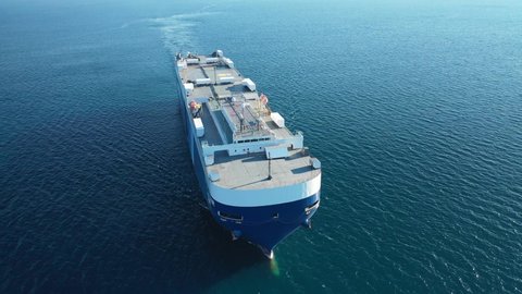 Piraeus port, Attica - Greece - February 22 2021: Aerial drone video of NYK lines huge car carrier ship RO-RO (Roll on Roll off) cruising near port of Piraeus