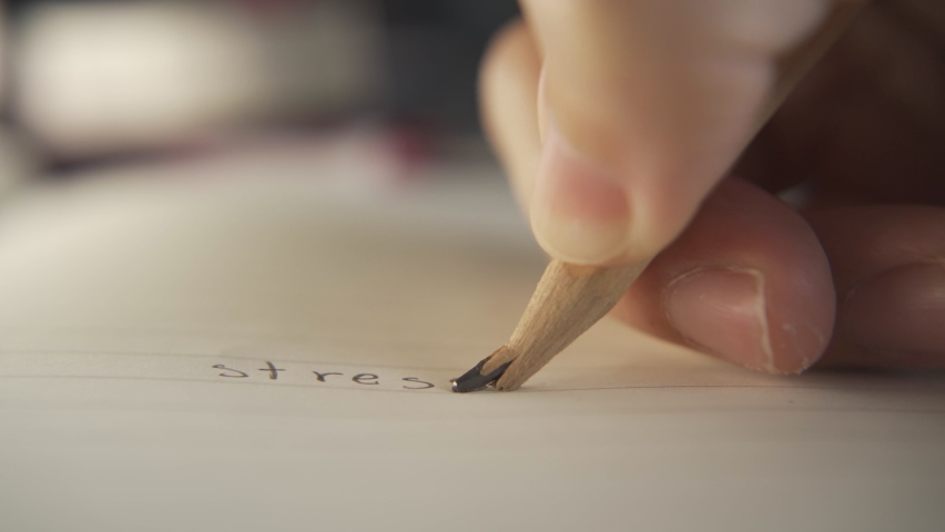 Breaking a pencil while writing stress. | Shutterstock HD Video #1067999102