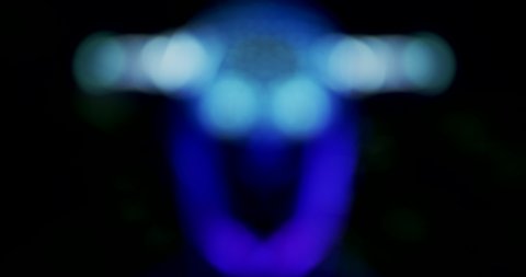 Fantastic, creative blurred background with modern and techno elements. Background for a presentation, relaxation or meditation. A human head, a moving abstract robot.