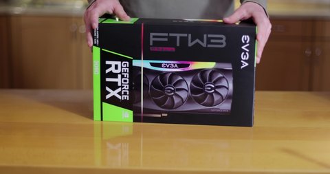 Budapest, Hungary - Circa 2020: Buying an Nvidia Geforce RTX 3090 Graphics Card made by EVGA in its box. High end GPU of the Nvidia RTX 30 series hard to get because of shortage lasting well into 2021