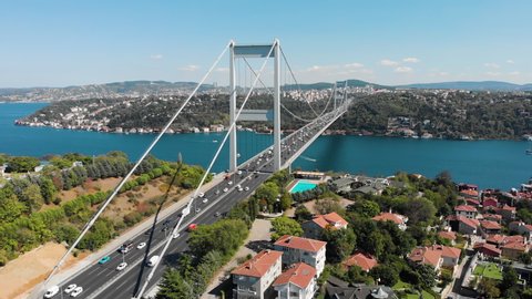 Establishing aerial drone view of Fatih Sultan Mehmet Bridge (Second Bosphorus Bridge) and car traffic at the day time in Istanbul, Turkey
