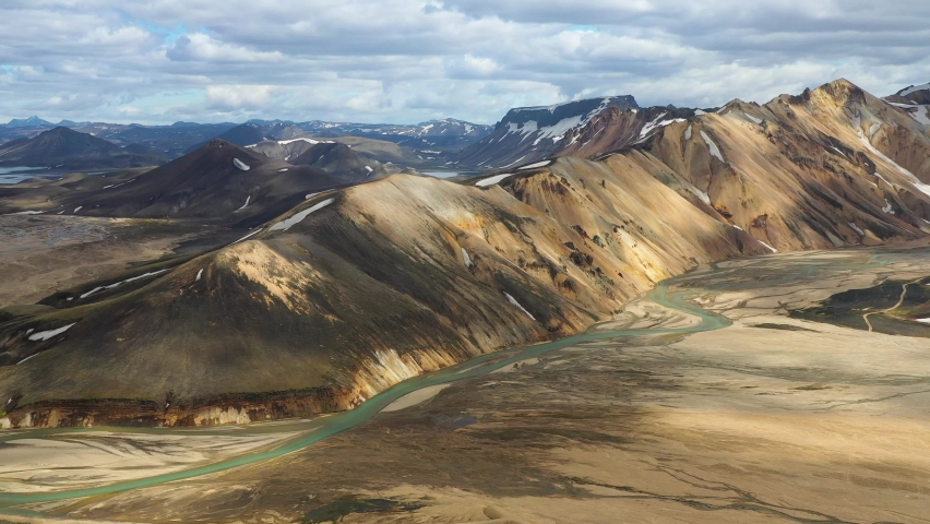 Flying towards scenic colorful Landmannalaugar mountains in Iceland
