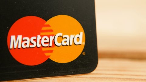 Dnipro Ukraine - 02 20 21: Mastercard credit card, stack of plastic bank card,