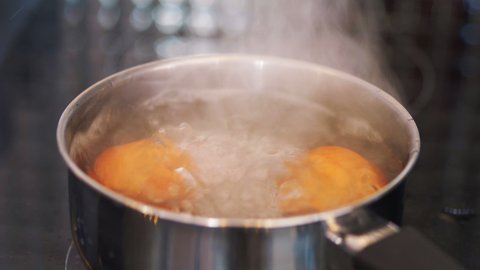 Eggs boiling in the pot in 4k slow motion 60fps
