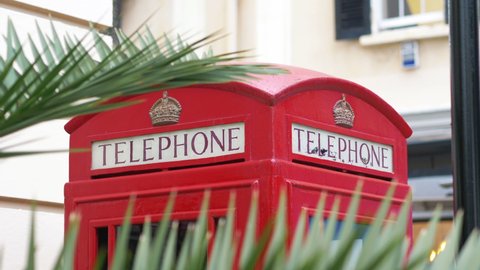 Red british telephone booth in 4k slow motion 60fps