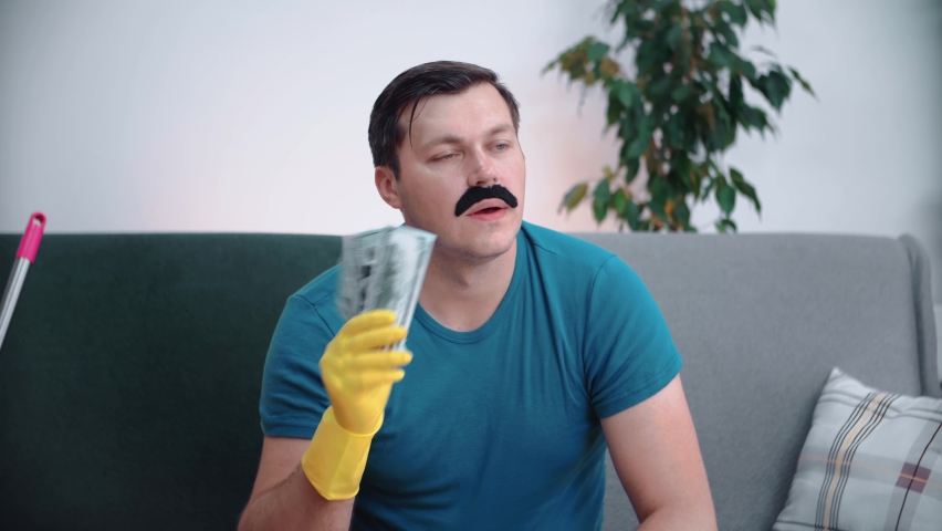 A man sitting on the couch made the day fan out himself.