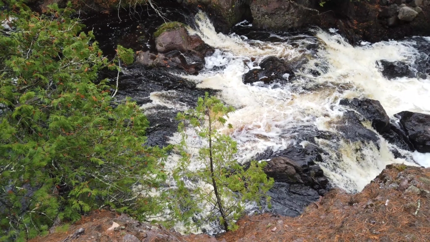Cascades tumble down the Bad River in Copper Falls State park in autumn