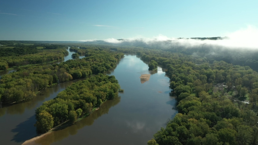 Clouds and a fog bank obscure the hills near the Wisconsin River during an autumn morning near Prairie du Chien in Wisconsin
