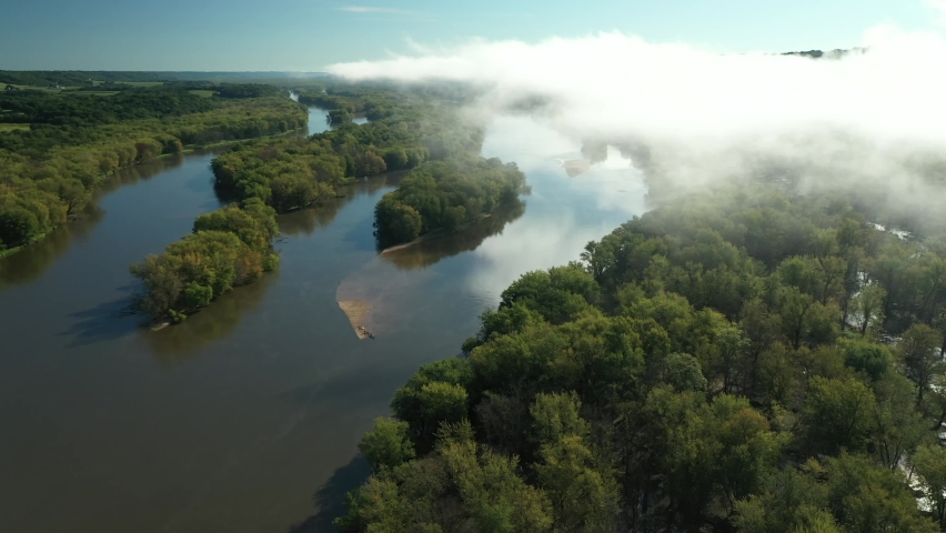 Clouds and a fog bank obscure the hills near the Wisconsin River during an autumn morning near Prairie du Chien in Wisconsin