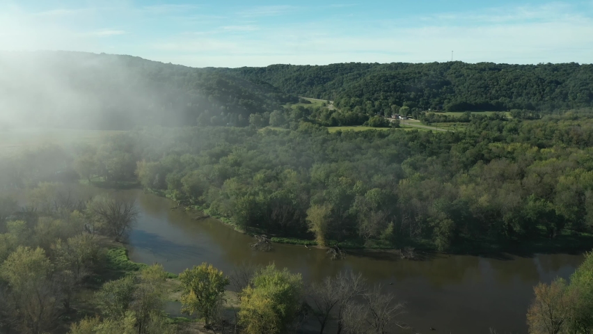 Clouds and a fog bank obscure the hills near the Wisconsin River during an autumn morning near Prairie du Chien in Wisconsin