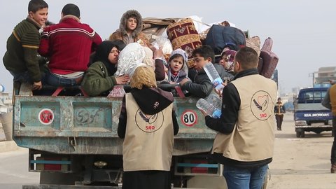 Aid workers provide urgent aid to displaced families fleeing the bombing of Idlib. The Syrian war. Syrian refugees.
Aleppo, Syria 17 April 2018