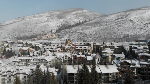 Aerial View Flying over the Vail Village town in Colorado during winter season, USA
