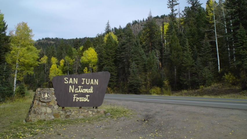 San Juan National Forest area sign by the road. Clips of US 160 heading to Treasure Falls Colorado and two of Treasure Falls signs and area. In Pagosa Springs, Colorado, U.S.