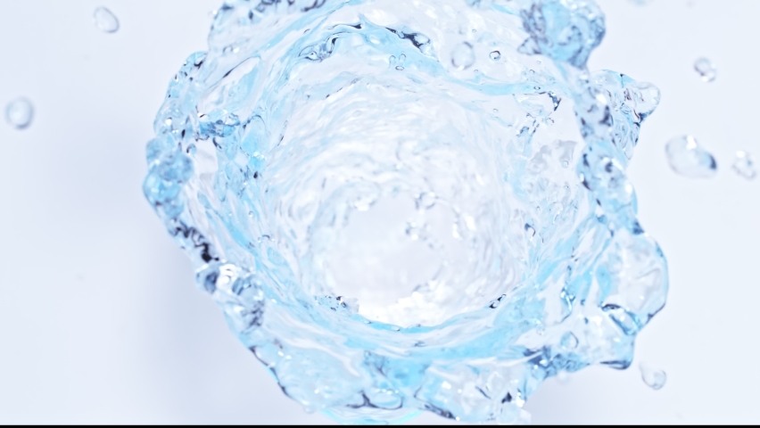 Super Slow Motion Shot of Water Vortex Splash Isolated on Light Blue Background at 1000fps. | Shutterstock HD Video #1068059951