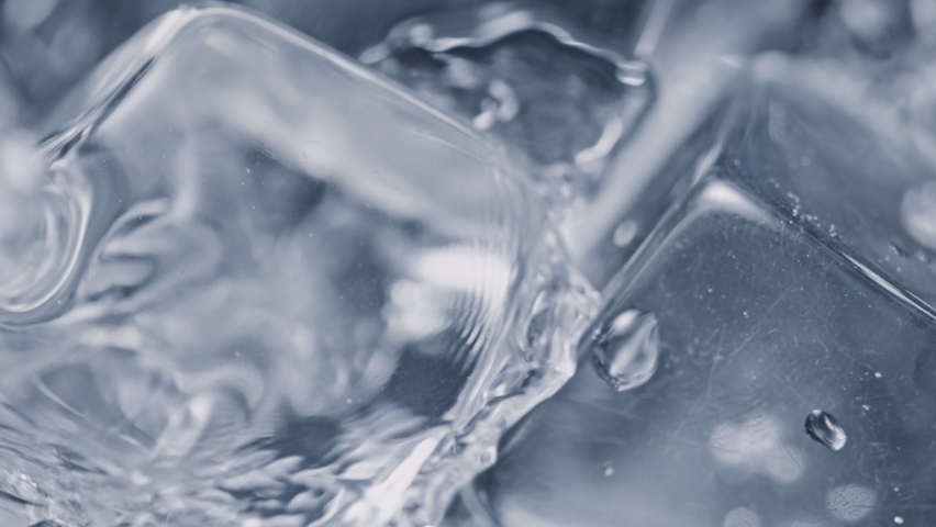 Super Slow Motion Detail Shot of Pouring Vodka on Ice Cubes at 1000 fps. Royalty-Free Stock Footage #1068059975