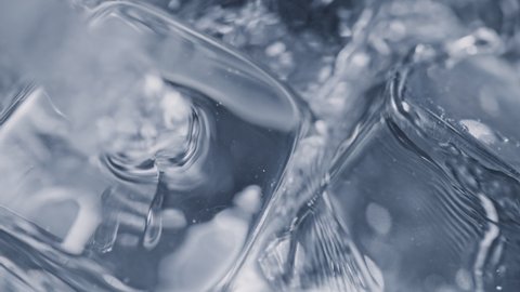 Super Slow Motion Detail Shot of Pouring Vodka on Ice Cubes at 1000 fps.