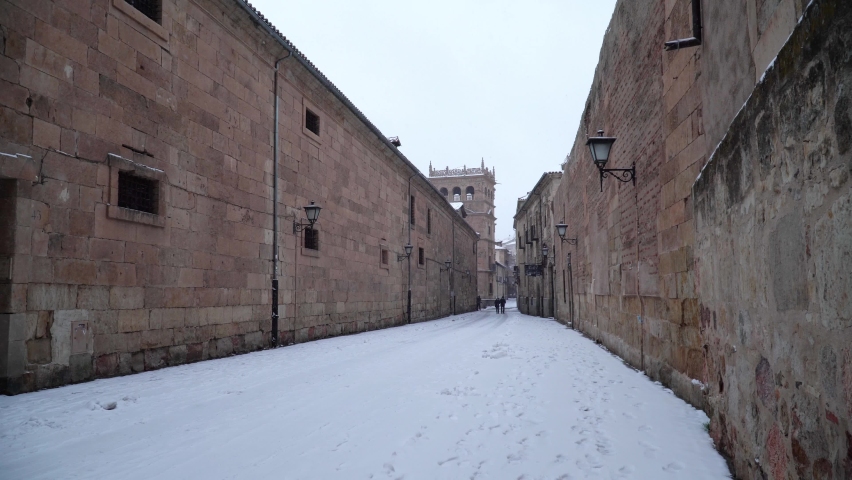 Snow in Salamanca city, Spain. Calle de la Compania view 