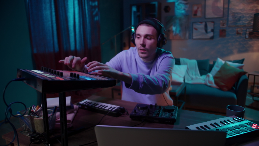 Young Man Practicing His Live DJ Set at Home, musician live during coronavirus covid 19 lockdown, music streaming podcast, famous professional artist Royalty-Free Stock Footage #1068068192