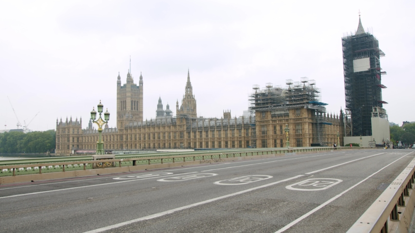 Lockdown in London, deserted Westminster Bridge in front of Big Ben and The Houses of Parliament, during 2020's COVID-19 pandemic. | Shutterstock HD Video #1068088166