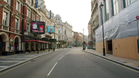 London , England , United Kingdom (UK) - 06 01 2020: Lockdown in London, closed theatres along deserted Shaftesbury Avenue, West End in beautiful morning sun light, during the Coronavirus pandemic 2020