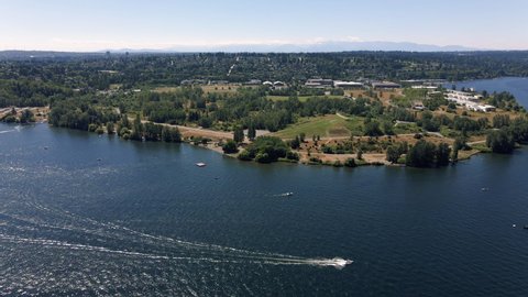 Lake Washington Summer Boating Aerial with Magnuson Park, Drone view of popular lake front walking destination in Seattle