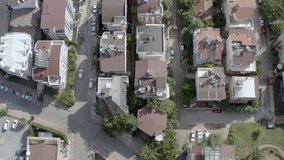 Drone video of urban cityscape with houses, roofs, streets and roads on them in an Asian city on the Mediterranean. Aerial view Antalya Turkey.