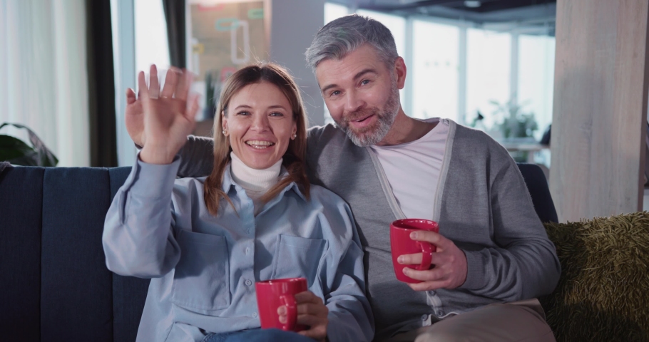 Caucasian beautiful nice young adult couple middle aged people videochat conference webcam talking videoblogging together casual lifestyle blog stayin ghome.