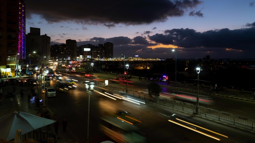 Time lapse of busy traffic on corniche road at night in Alexandria Egypt